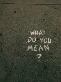 what do you mean? text on gray surface